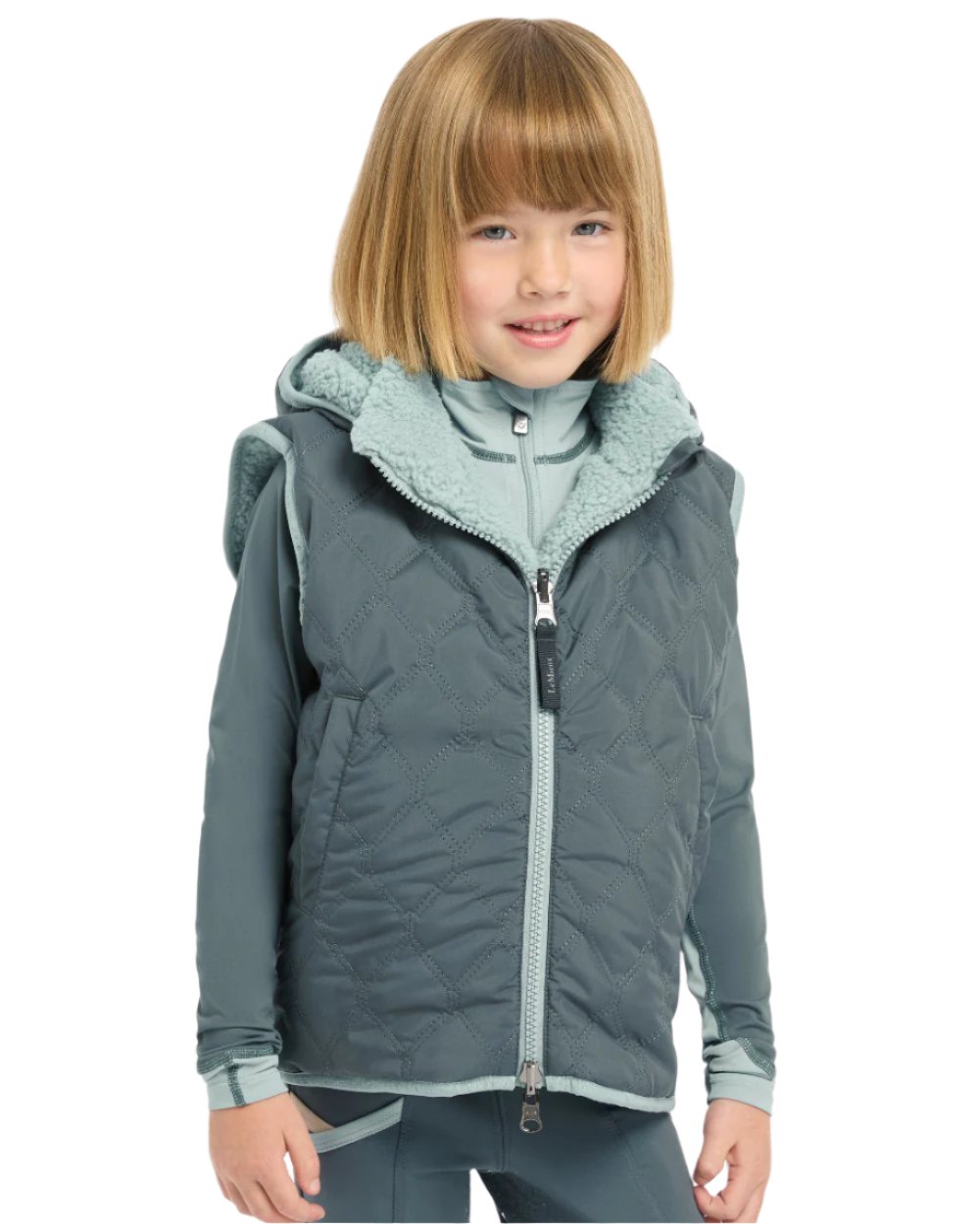 Petrol Coloured LeMieux Mini Elsie Reversible Gilet On A White Background 