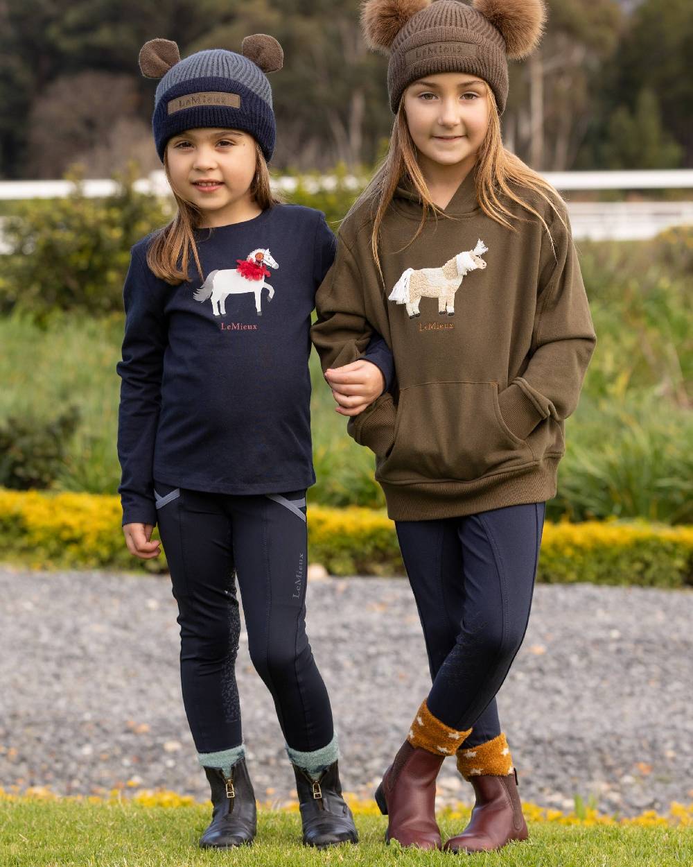 Navy Coloured LeMieux Mini Jessie Long Sleeve Top On A street Background 