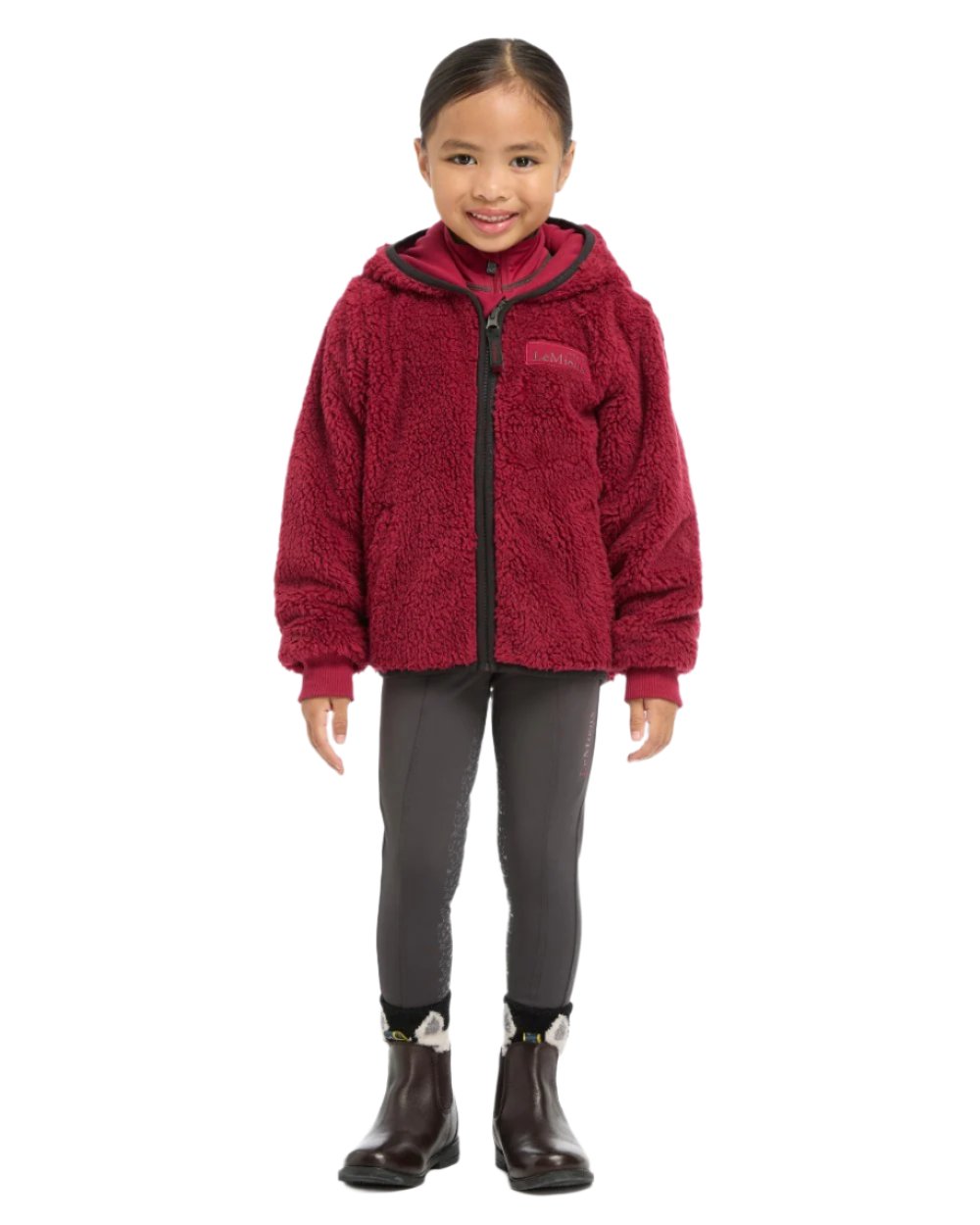 Ember Coloured LeMieux Mini Teagan Fleece Jacket On A White Background 