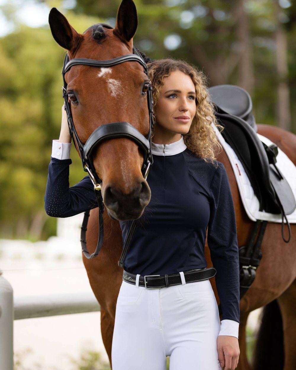 Navy coloured LeMieux Olivia Long Sleeve Show Shirts on green background 