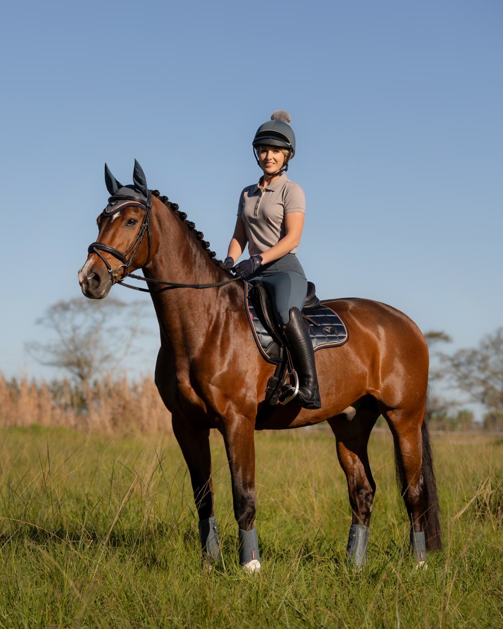 Petrol Coloured LeMieux Pippa Hat Silk On A Riding Arena Background 