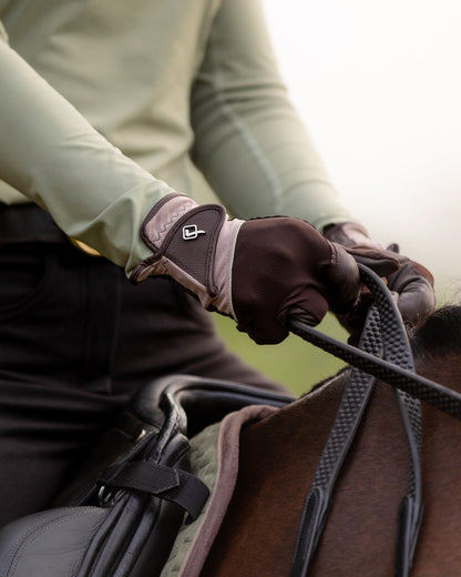 Fern coloured LeMieux Pro Mesh Gloves with horse in background 