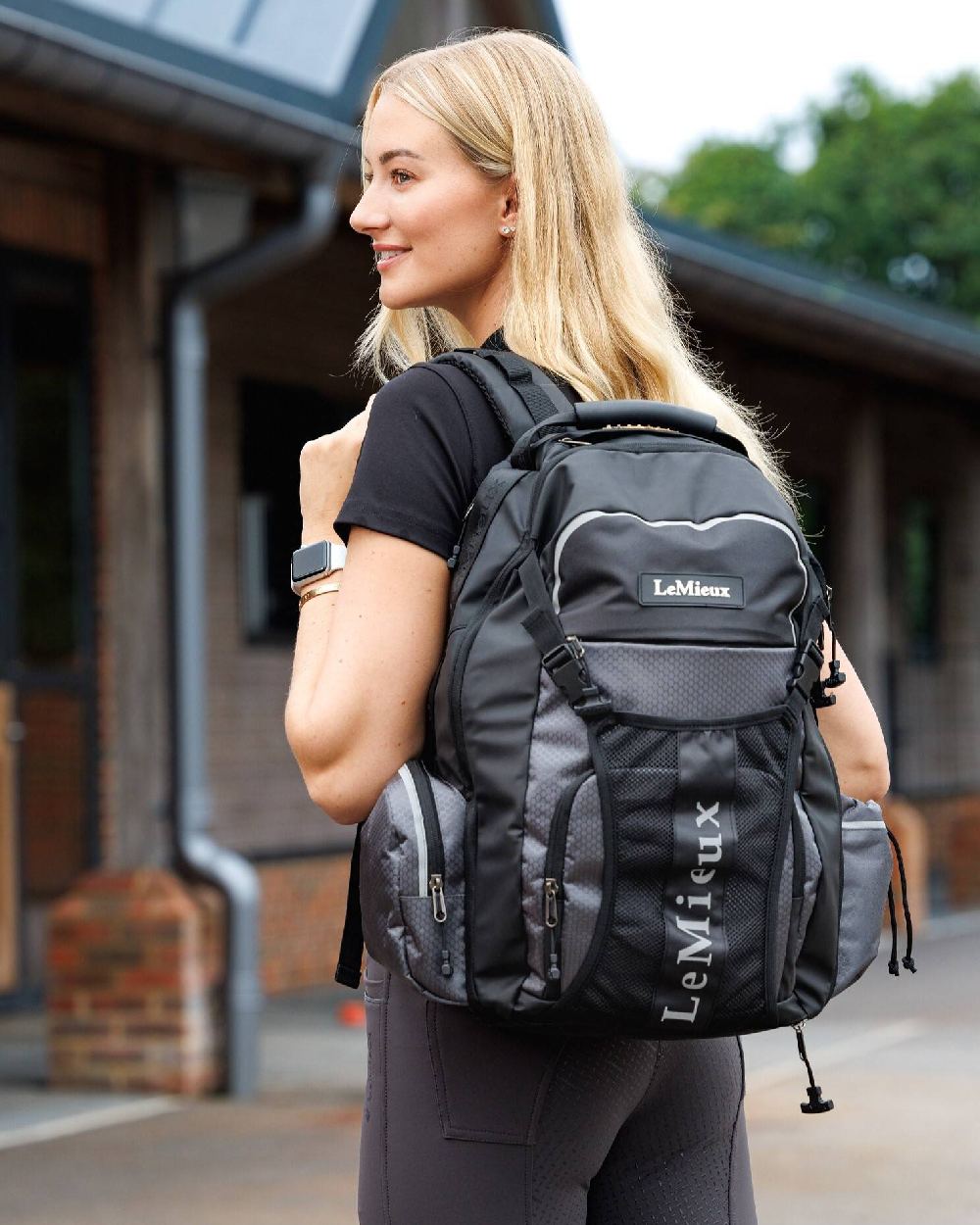 Black coloured LeMieux Pro Rucksack on blurry stable background 