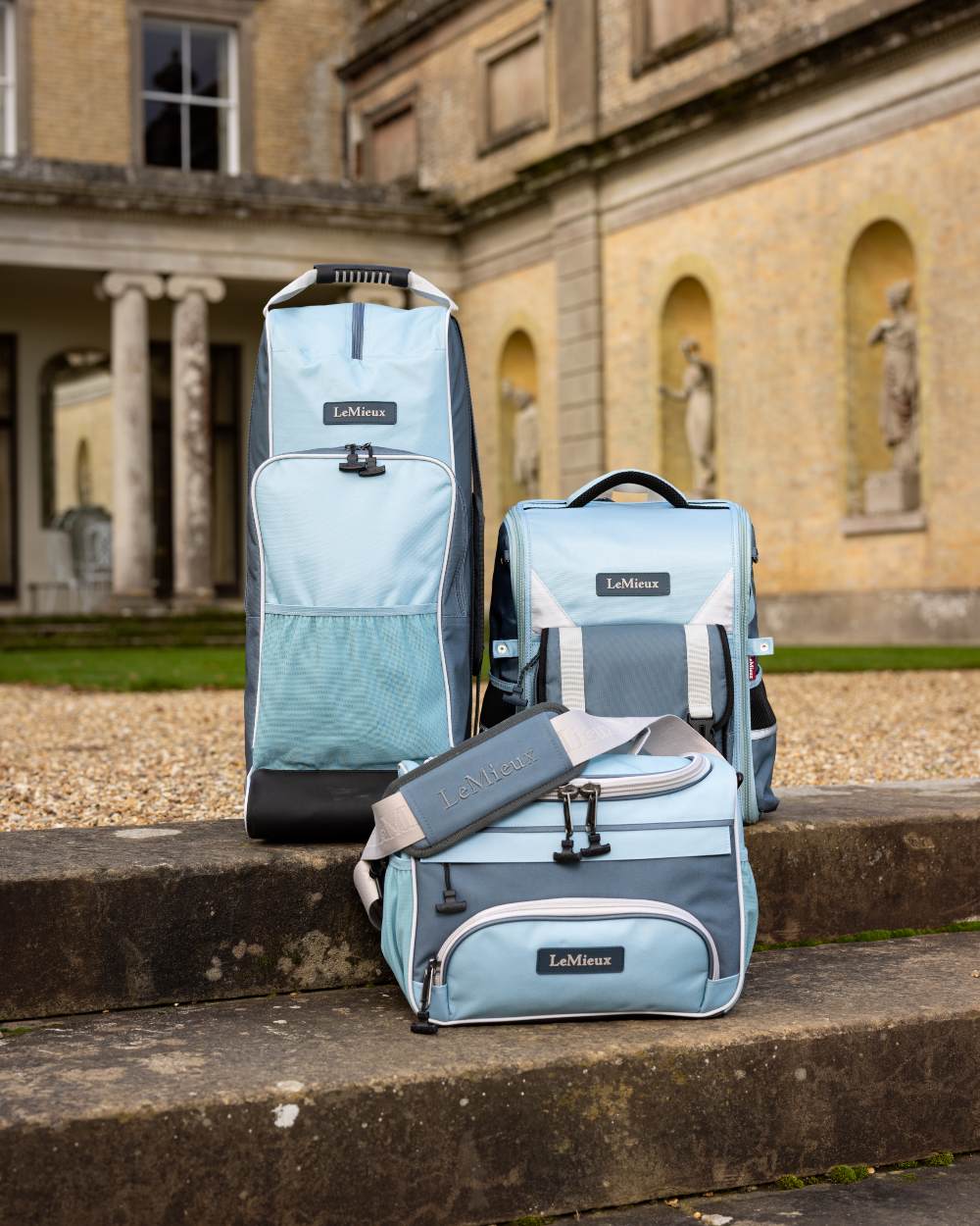 Petrol Coloured LeMieux ProKit Lite Grooming Bag On A Outer Yard Background 