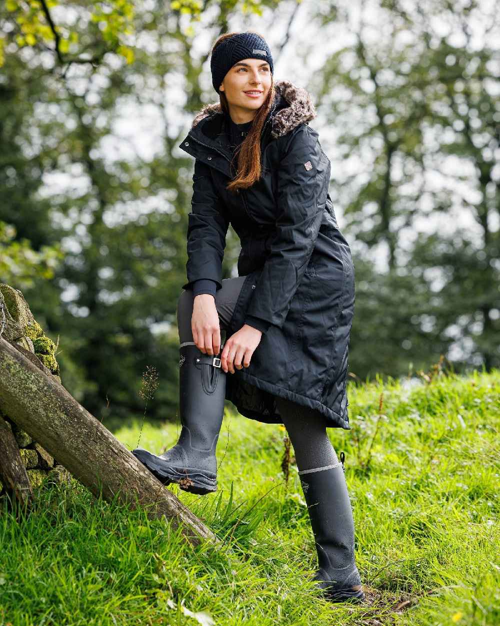 Navy coloured LeMieux Stride Wellington Boots on forest background 