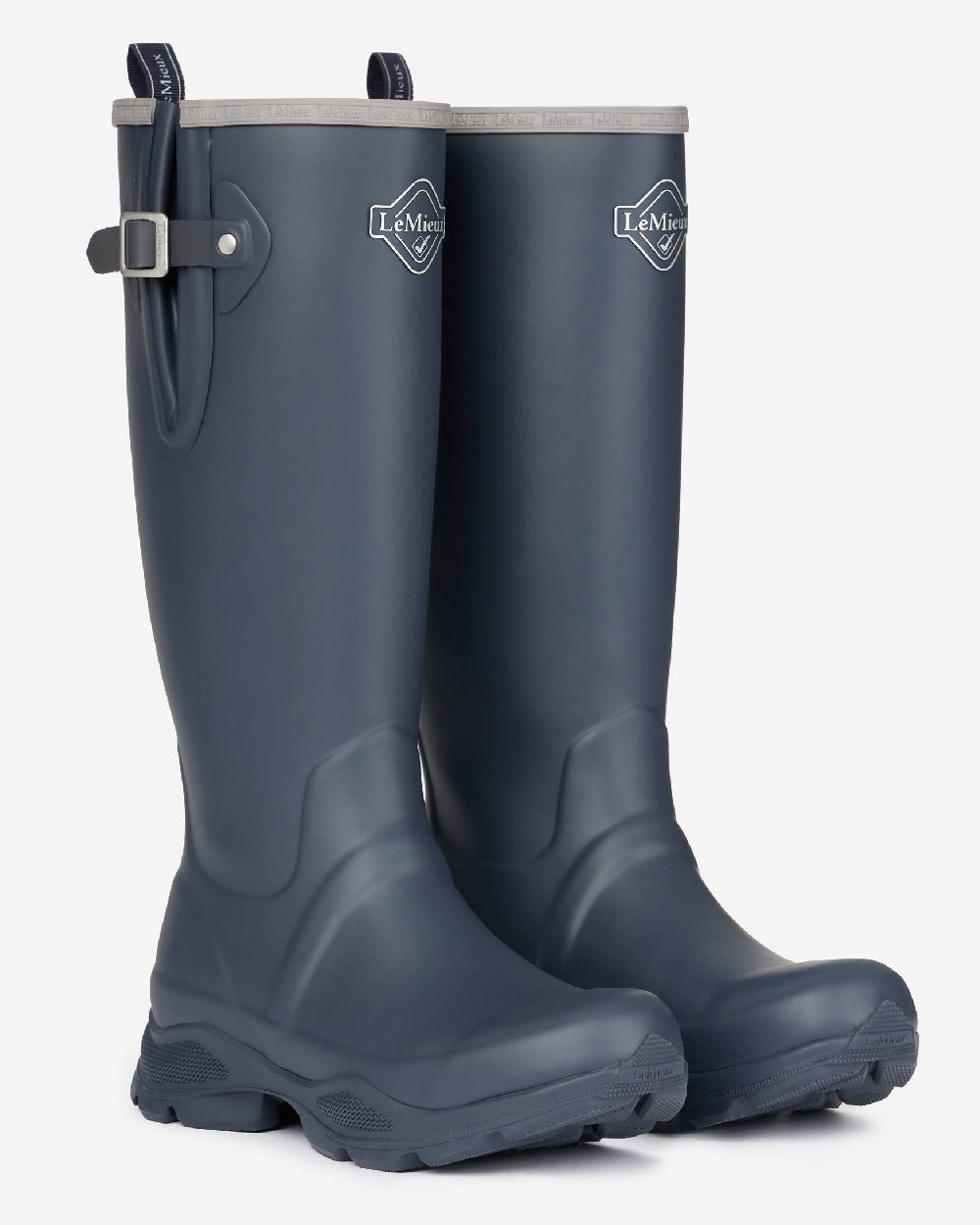 Navy coloured LeMieux Stride Wellington Boots on grey background 