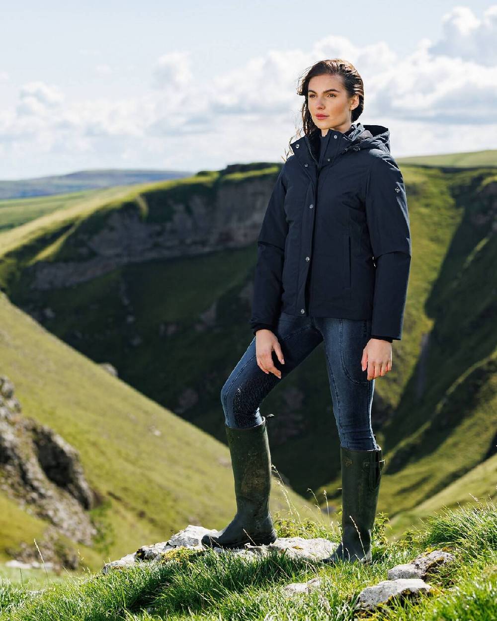 Oak coloured LeMieux Stride Wellington Boots on mountain background 