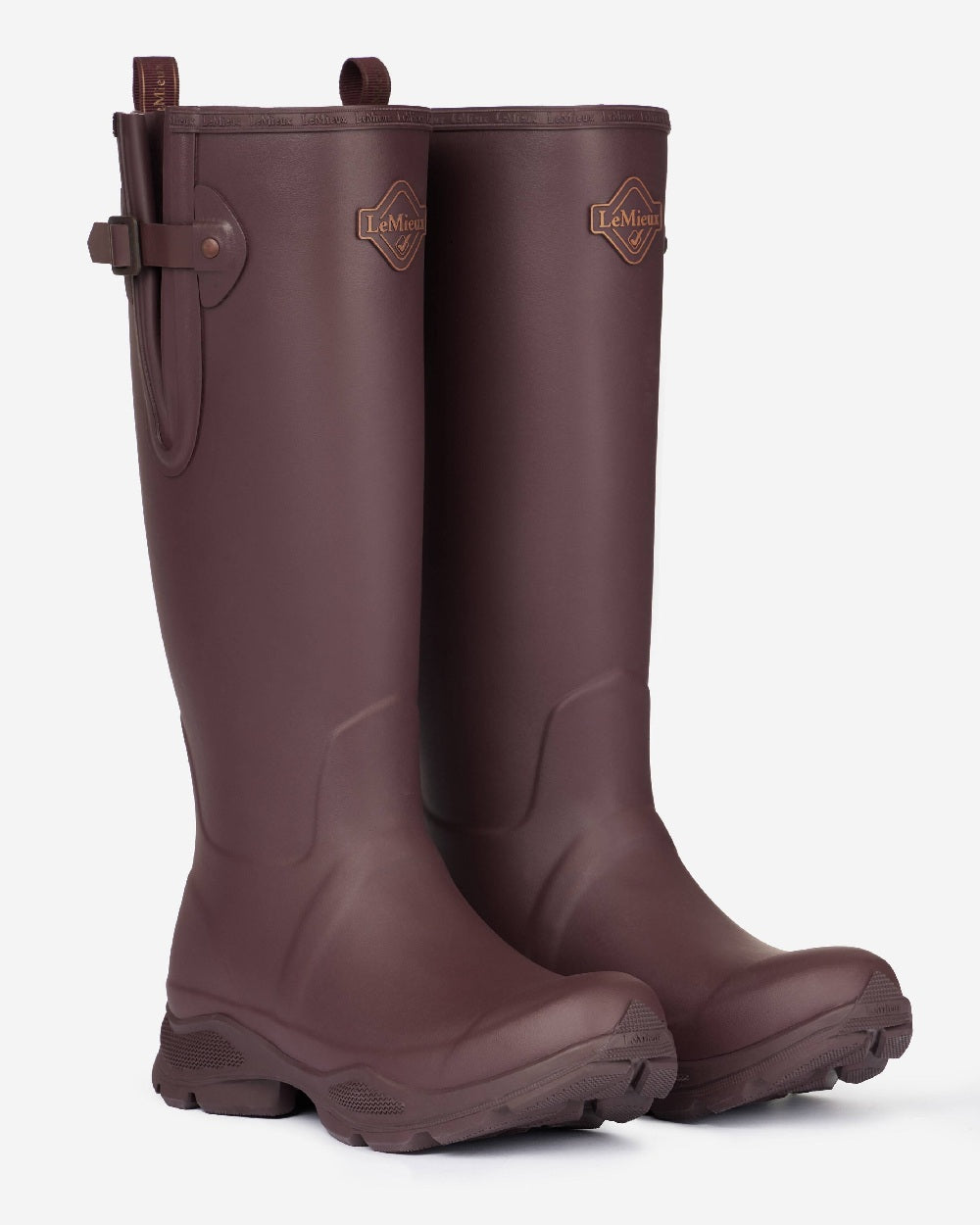 Port coloured LeMieux Stride Wellington Boots on grey background 