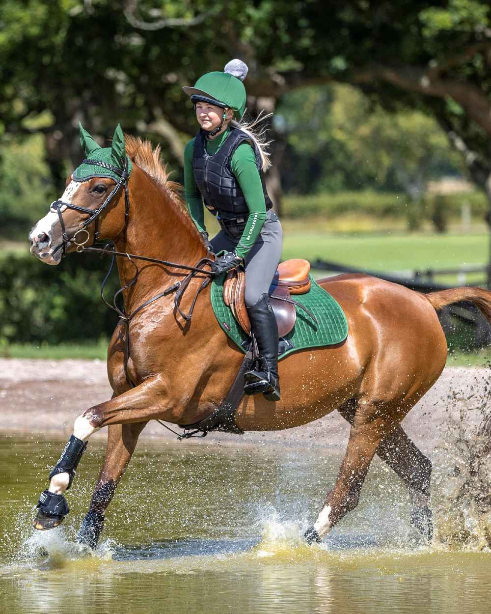 Hunter Green coloured LeMieux Suede Close Contact Squares on horse background 