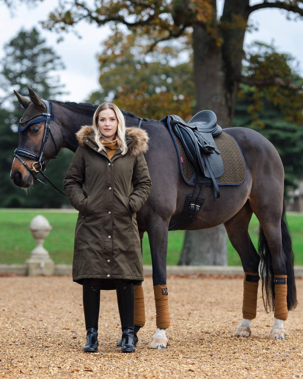 Alpine Coloured LeMieux Suede Dressage Square On A Outer Yard Background 