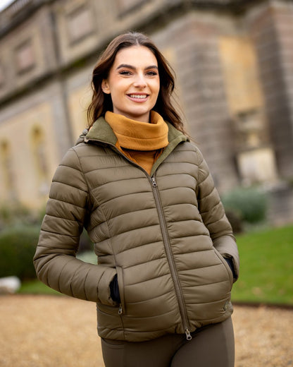 Alpine Coloured LeMieux Tilly Hooded Puffer Jacket On A Outer Yard Background 