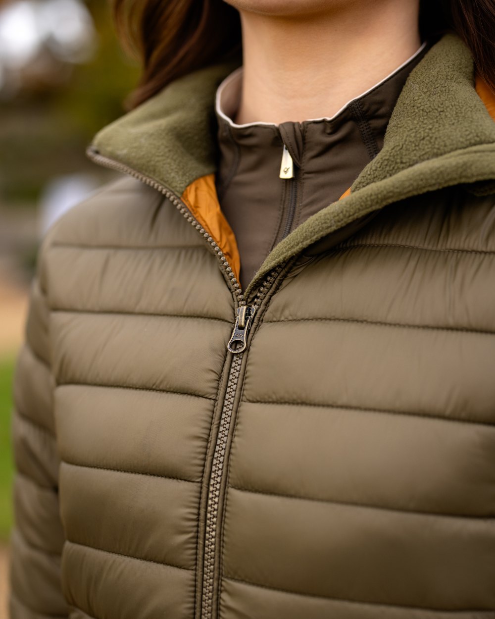 Alpine Coloured LeMieux Tilly Hooded Puffer Jacket On A Outer Yard Background 