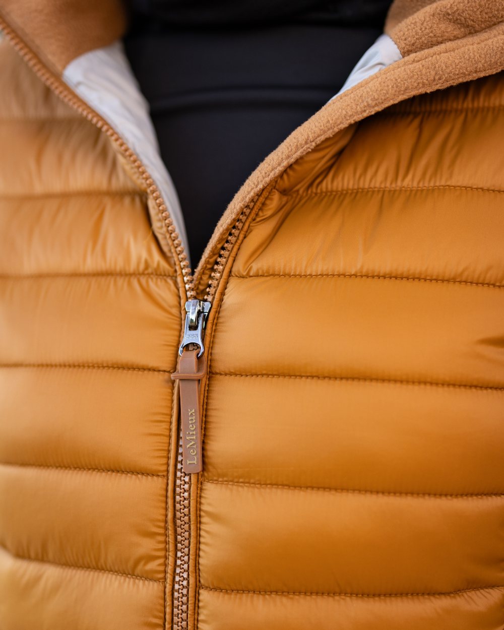 Ginger Coloured LeMieux Tilly Hooded Puffer Jacket On A White Background 