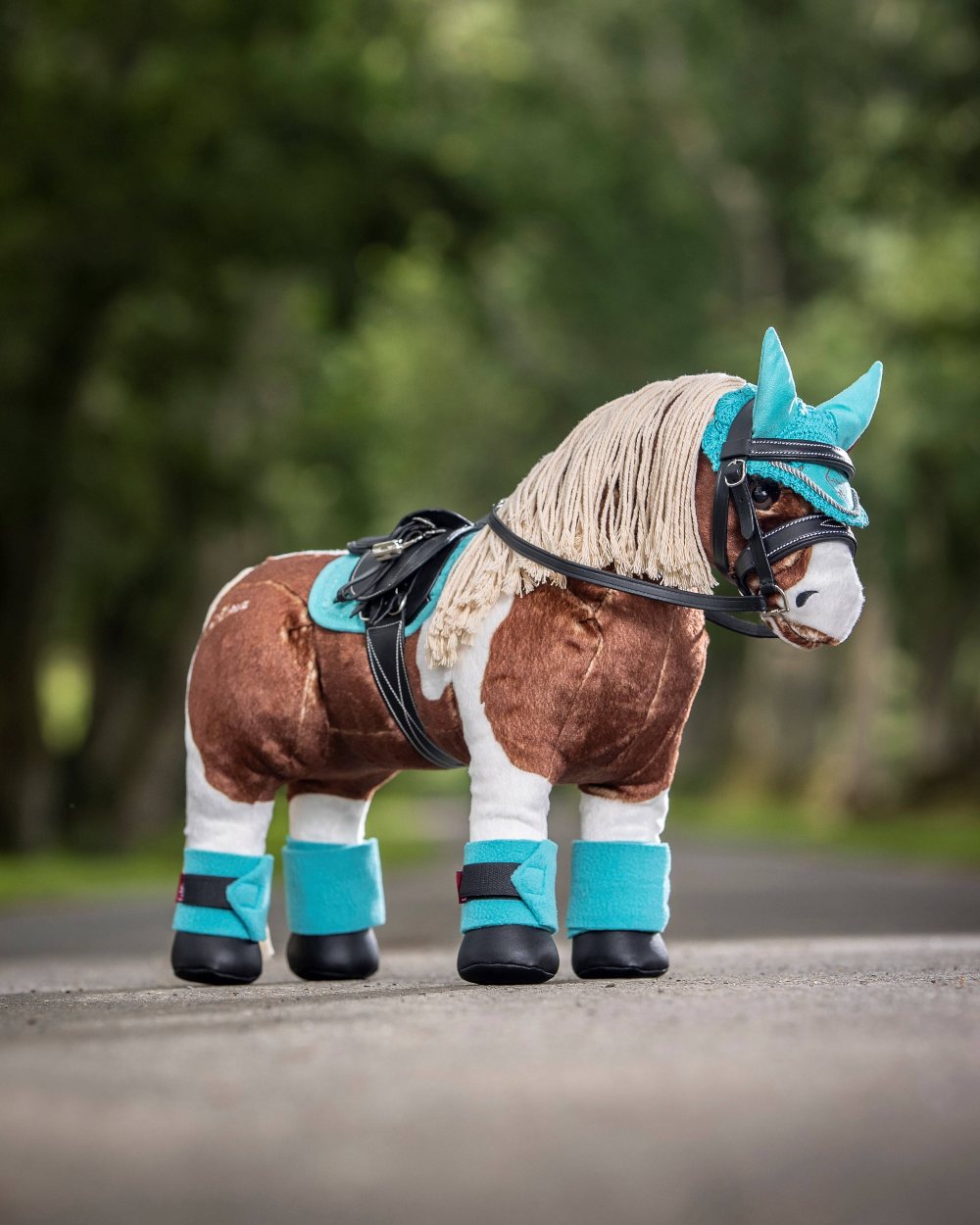 Azure coloured LeMieux Toy Pony Bandages on blurry background 