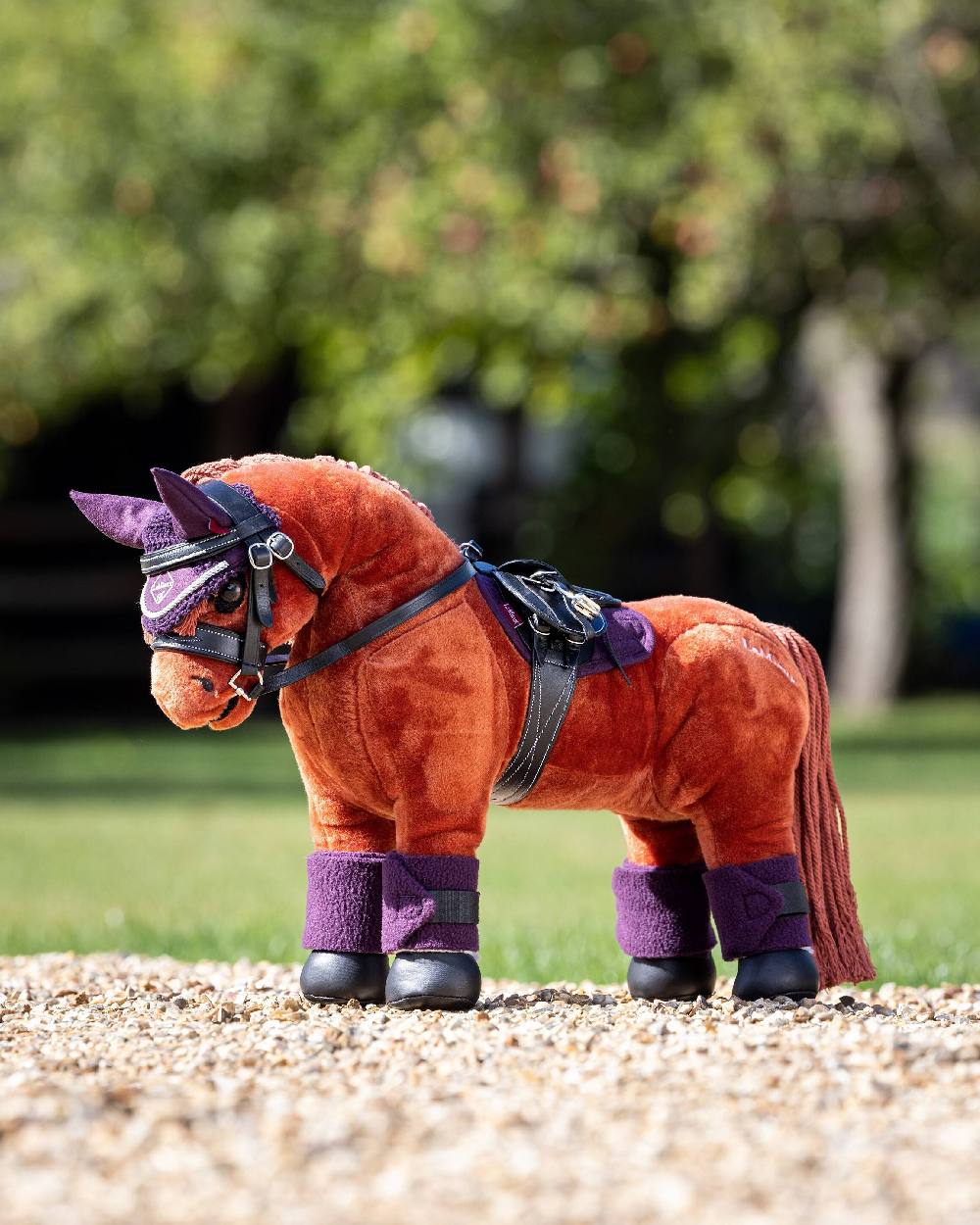 Fig coloured LeMieux Toy Pony Bandages on blurry background 