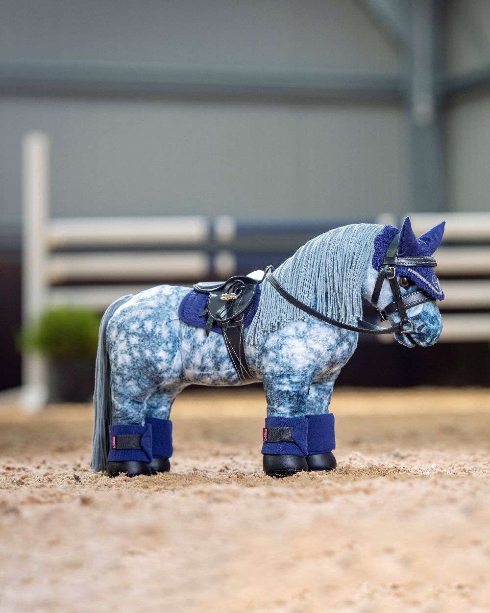 Ink Blue coloured LeMieux Toy Pony Bandages on blurred pen background 