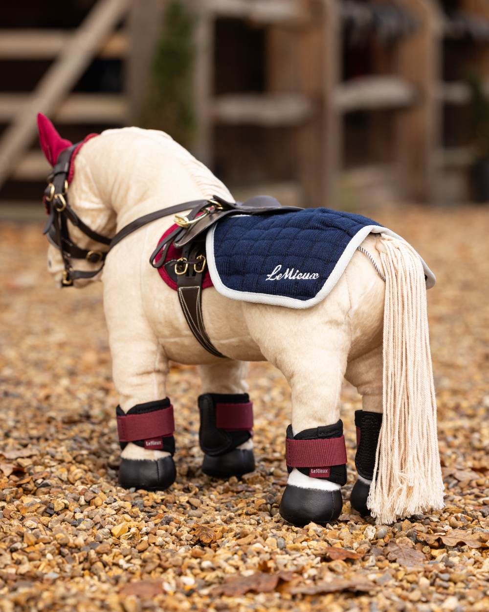 Ember Coloured LeMieux Toy Pony Grafter Boots On A Outer Yard Background 