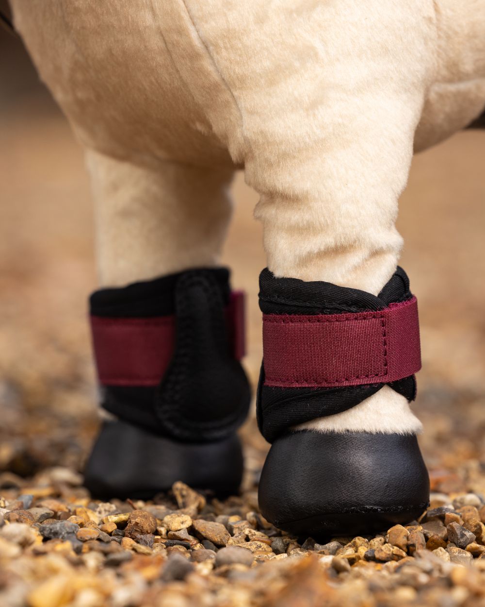 Ember Coloured LeMieux Toy Pony Grafter Boots On A Outer Yard Background 