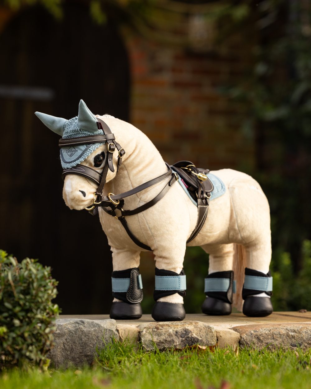 Glacier Coloured LeMieux Toy Pony Grafter Boots On A Outer Yard Background 