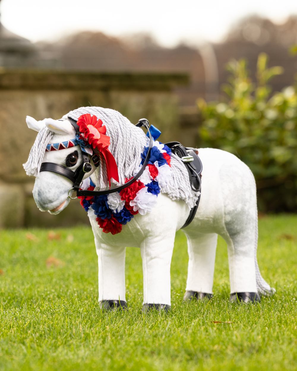 Multi Coloured LeMieux Toy Pony Rosette Pack On A Outer Yard Background 