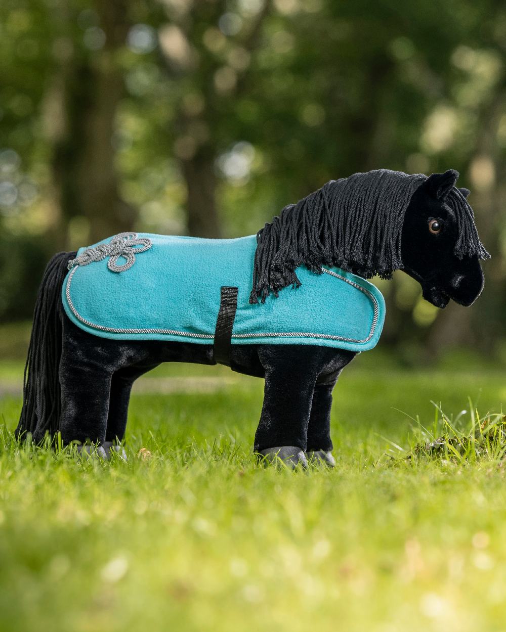 Azure coloured LeMieux Toy Pony Rug on green background 