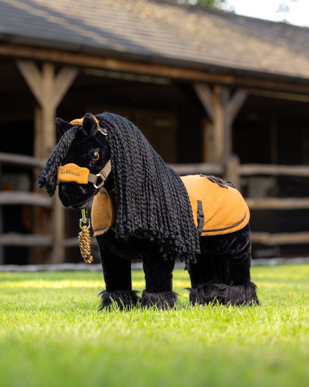 Ginger Coloured LeMieux Toy Pony Rug On A Stable Background 