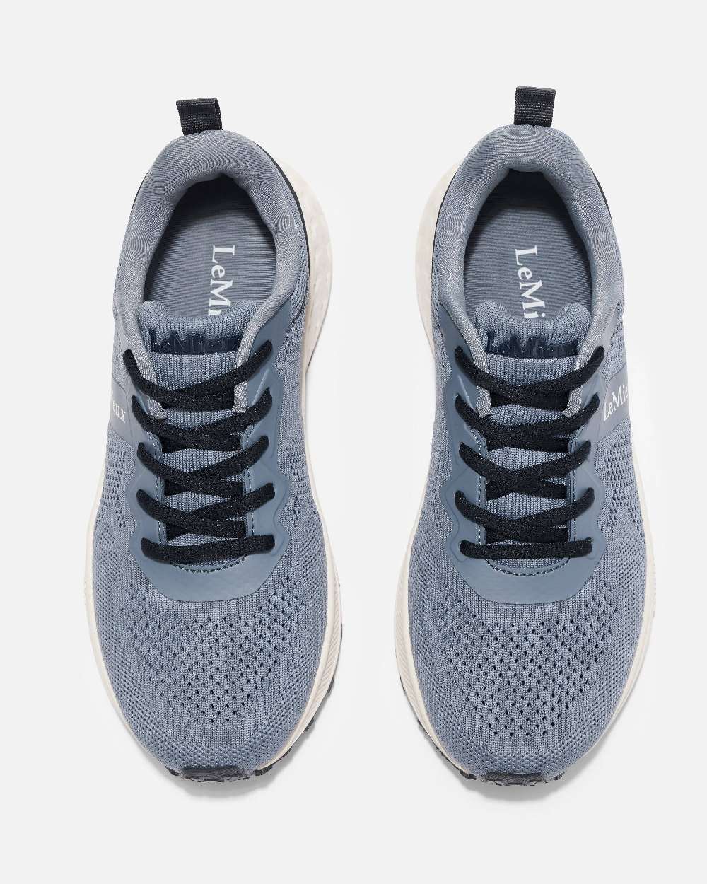 Jay Blue coloured LeMieux Trax-Lite Trainer on grey background 