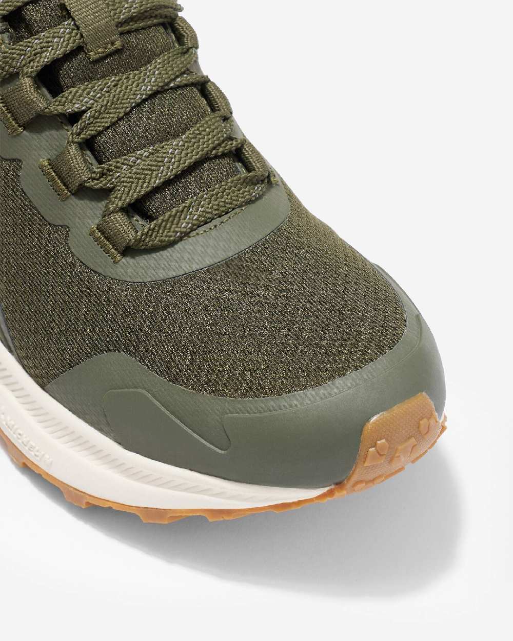 Khaki coloured LeMieux Trax Waterproof Trainers on grey background 