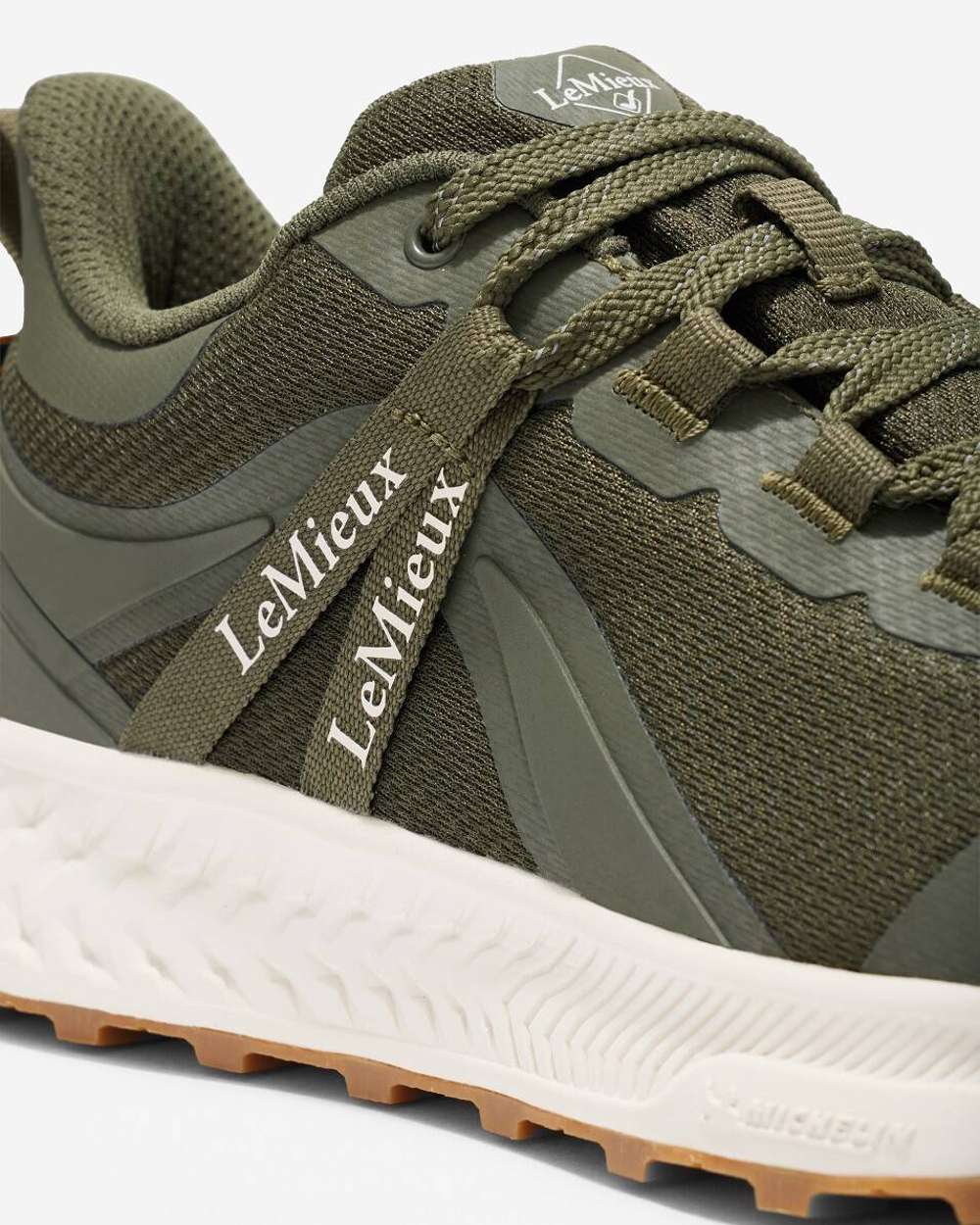 Khaki coloured LeMieux Trax Waterproof Trainers on grey background 