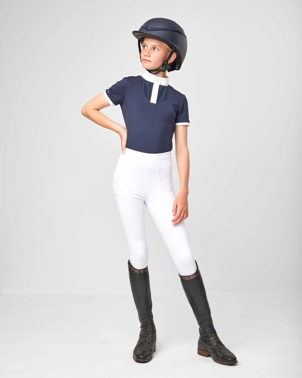 Navy coloured LeMieux Young Rider Belle Show Shirts on grey background 