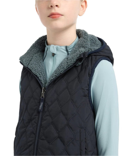 Navy Coloured LeMieux Young Rider Eloise Reversible Winter Gilet On A White Background 