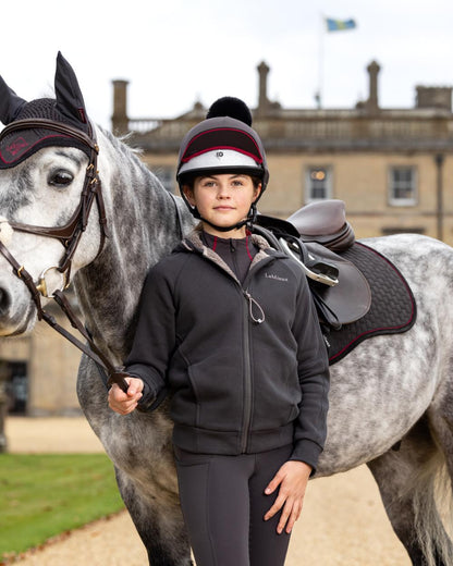 Cinder Coloured LeMieux Young Rider Orla Pull Ons On A Outer Yard Background 