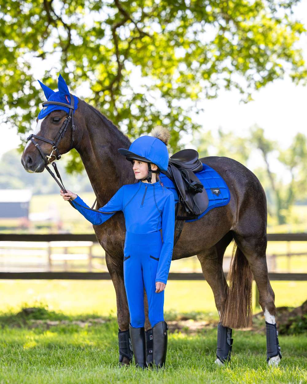 Benetton Blue Coloured LeMieux Young Rider Pull On Breeches On A riding arena Background 