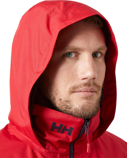 Red coloured Helly Hansen Mens Crew Hooded Midlayer Jacket on white background 