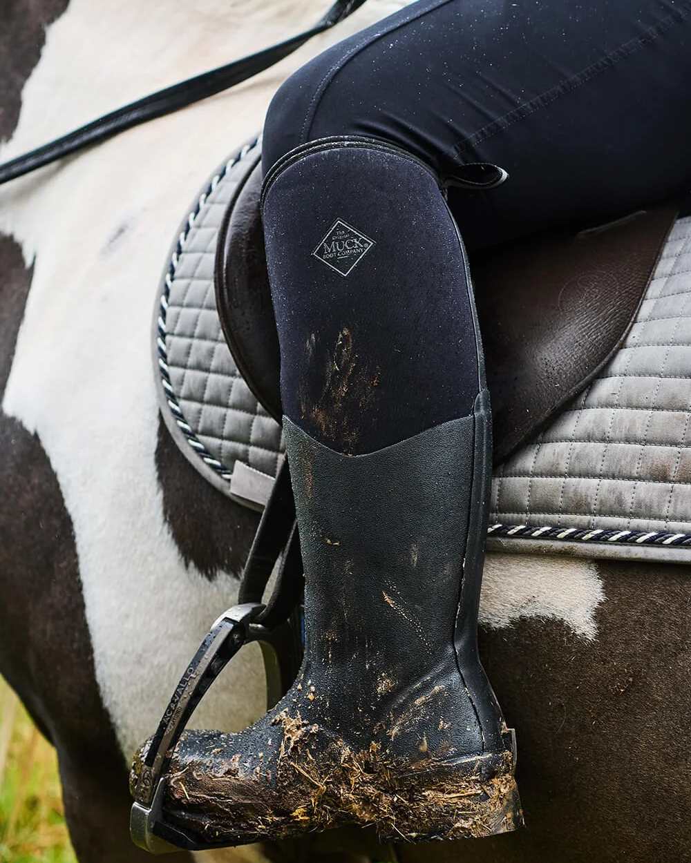 Black Coloured Muck Boots Colt Ryder All Conditions Riding Boots on Outdoor Background

