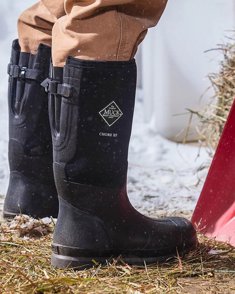 Black Coloured Muck Boots Mens Chore Adjustable Tall Wellingtons On A Snow Background