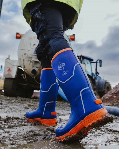 Blue Orange Coloured Muck Boots Mens Grit S5 Tall Boots on Outdoor Background
