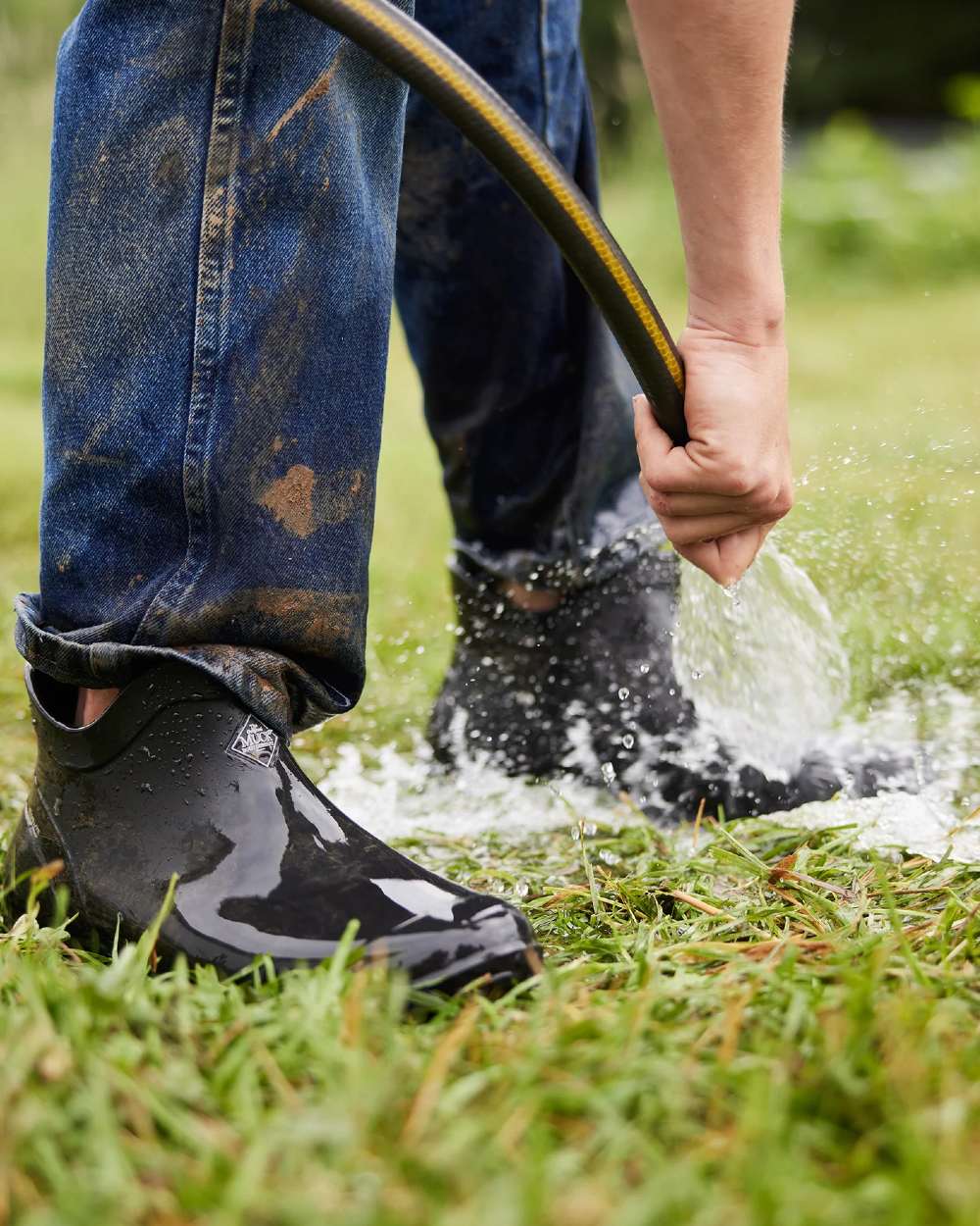 Black Coloured Muck Boots Mens Muckster Lite Ankle Boots On A Garden Background 