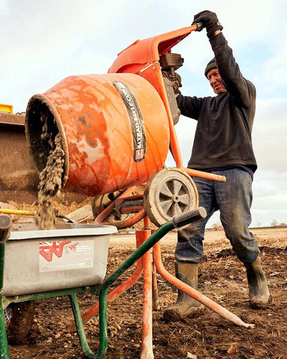 Moss Coloured Muck Boots Muckmaster Mid Wellingtons On A Field Background