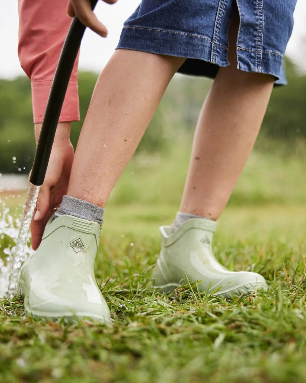 Resida Green Coloured Muck Boots Womens Muckster Lite Ankle Boots On A Garden Background 