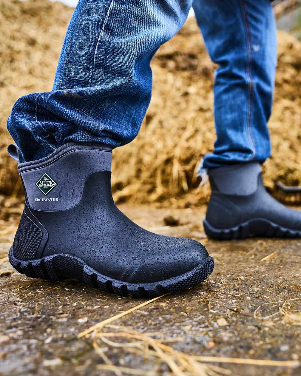 Black Coloured Muck Boots Edgewater Classic Ankle Boots On A Shelter Background