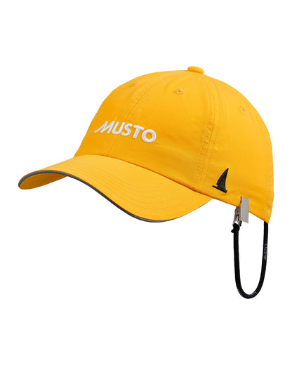 Gold coloured Musto Essential Fast Dry Crew Cap on White background 