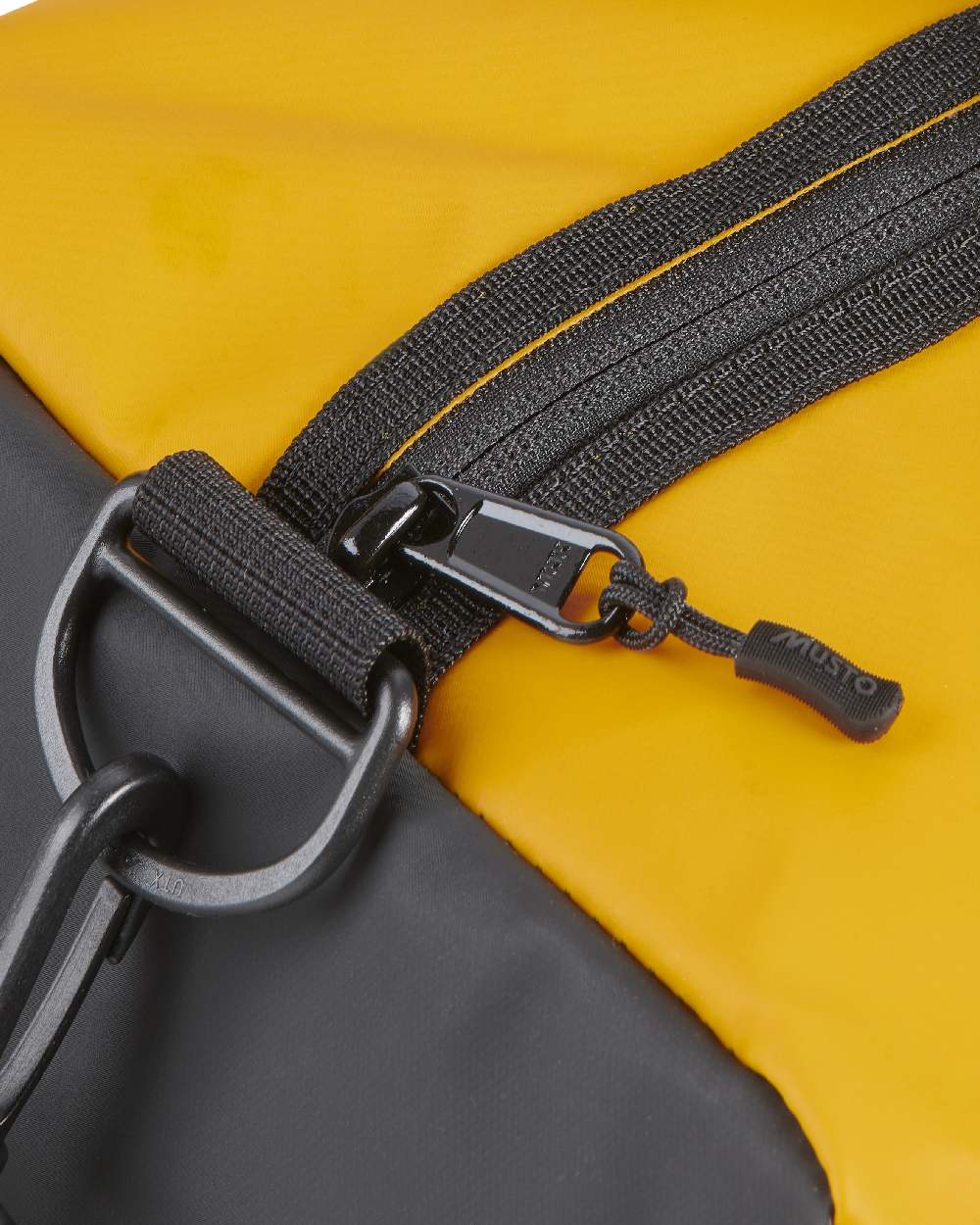 Gold Coloured Musto Genoa Small Carryall on White Background
