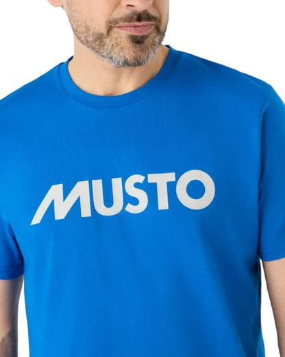 Aruba Blue Coloured Musto Logo Tee On A White Background 
