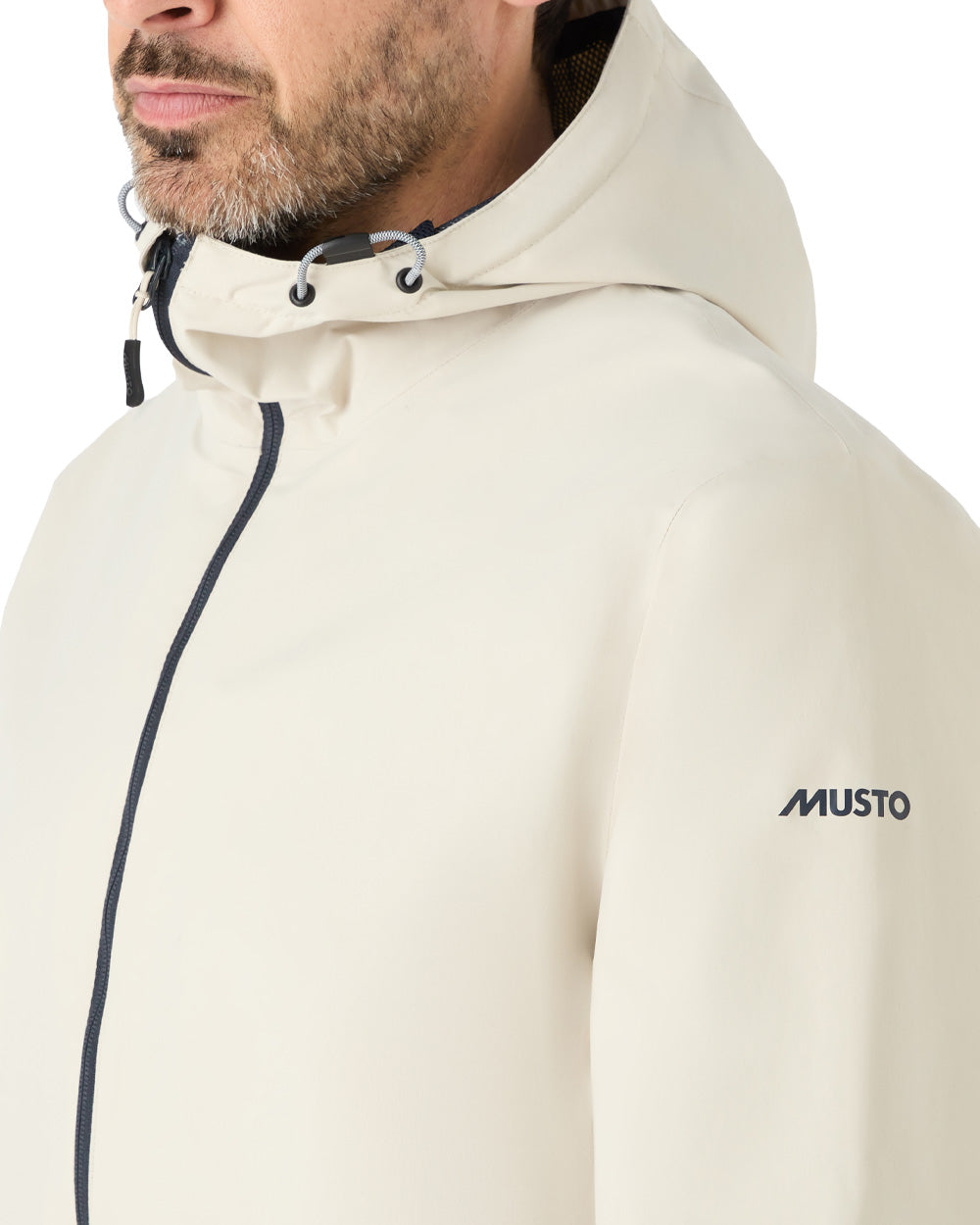 Pumice coloured Musto Marina Rain Jacket on White background 