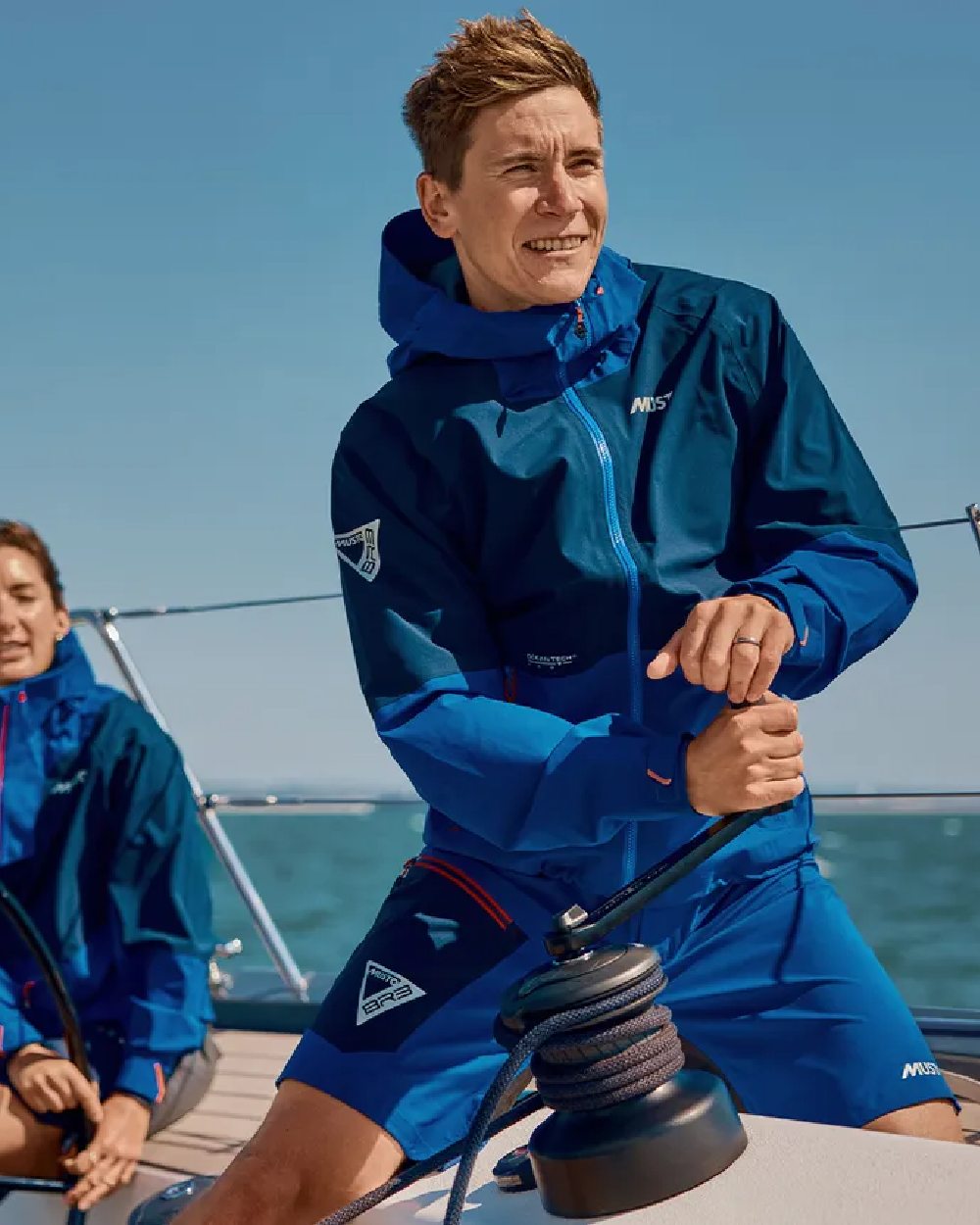 Mazarine Blue Coloured Musto Mens Br3 Sport Jacket on Sea Background
