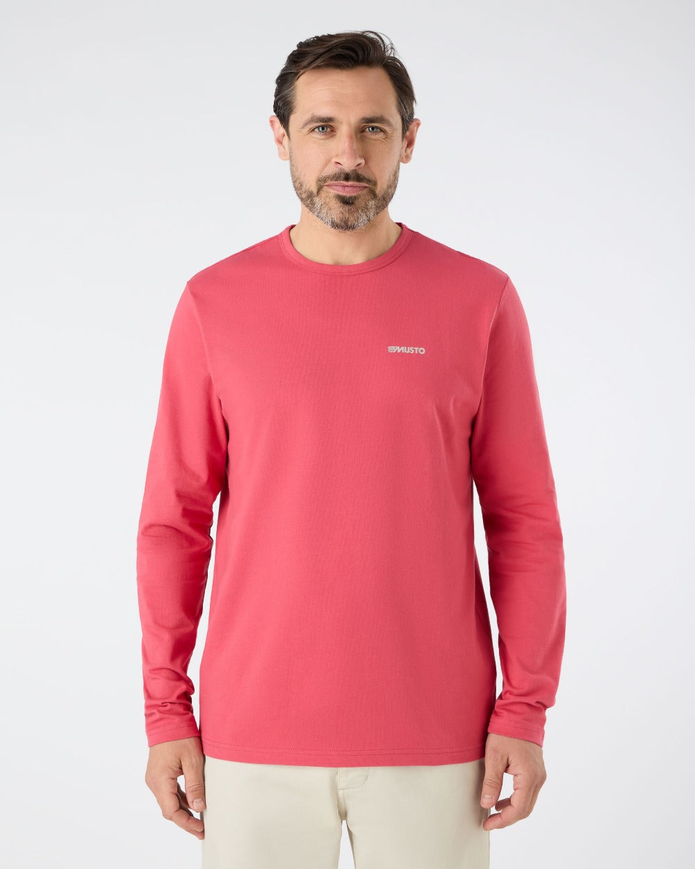 Sweet Raspberry coloured Musto Mens Marina Long Sleeve Logo T-Shirt on grey background 