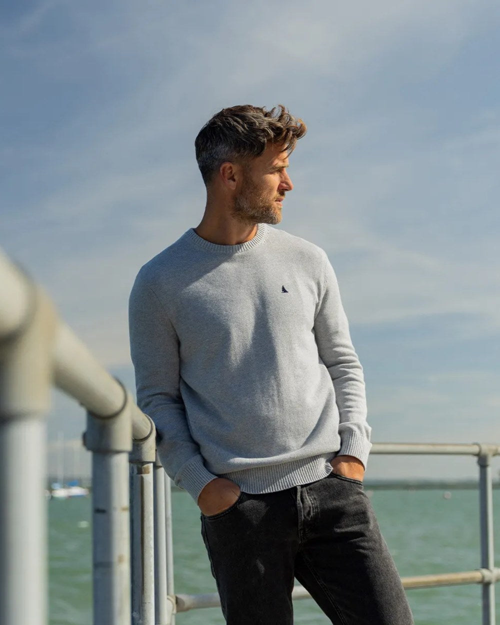 Grey Melange Coloured Musto Mens Original Crew Neck Sweater on Blurry Background
