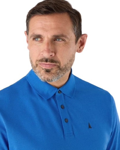 Nebulas Blue Coloured Musto Mens Original Short Sleeve Polo Shirt on White Background
