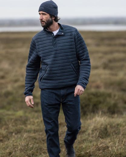 Navy Coloured Musto Mens Snug Pullover On A Grass Background 